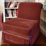 F50. Maroon colored slipper chair. 32”h x 26”w x 32”d 